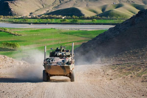 An Australian service light armored vehicle drives through Tangi Valley, Afghanistan, March 29. The terrain of Tangi Valley is notoriously rough, but the ASLAV maneuvers across it with ease, said Australian army Lt. McLeod Wood, a troop leader for 2nd Cavalry Regiment, Mentoring Task Force 2, Combined Team Uruzgan.